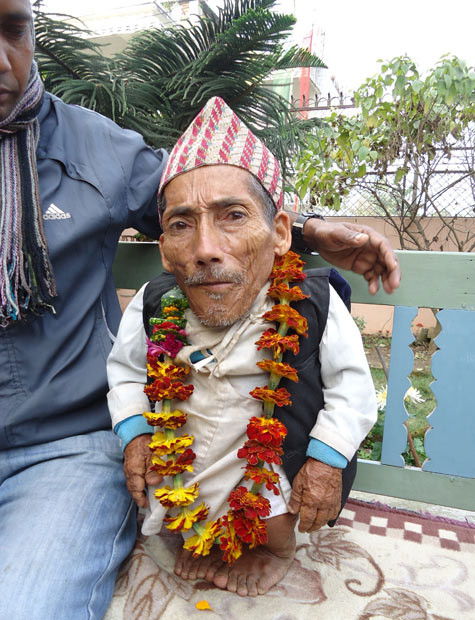 Chandra Bahadur Dangi, a 72-year-old Nepali who claims to be the world’s shortest man at 56 centimetres (22 inches) tall, takes part in a media conference in Jhapa district, southeastern Nepal. The record is currently held by Junrey Balawing of the Philippines, who measures 59.93cm. He took the title last year from another Nepali man, Khagendra Thapa Magar, who measured 67cm.