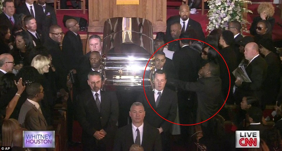 Whitney Houston’s boyfriend: Ray J emotionally reaches out to her coffin at the end of her funeral. The rapper put his hand out and touched the casket as it passed him down the aisle of the church, before collapsing into his seat overcome with emotion Read more: http://www.dailymail.co.uk/news/article-2102985/Whitney-Houston-Funeral-A-galaxy-stars-gather-New-Jersey-say-goodbye-pop-legend.html#ixzz1mnCOv5u8