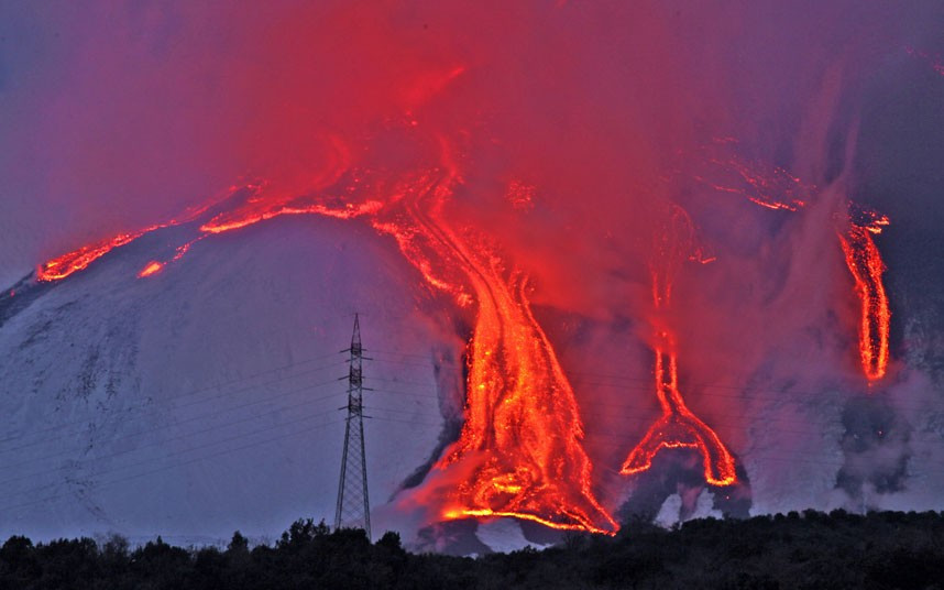 Lava flows down the flanks of Mount Etna in Sicily