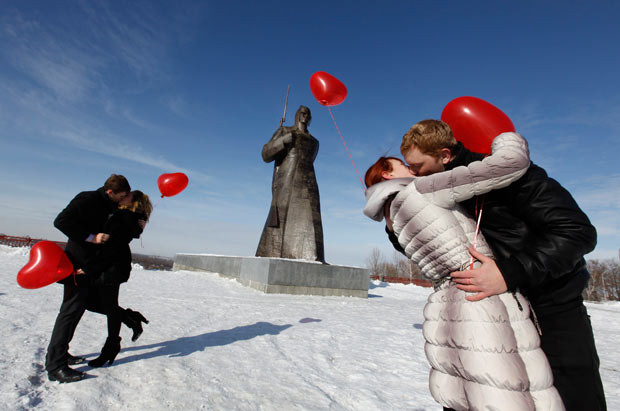 Couples kiss during a flashmob organised by a local television station on the eve of Valentine’s Day in the southern Russian city of Stavropol