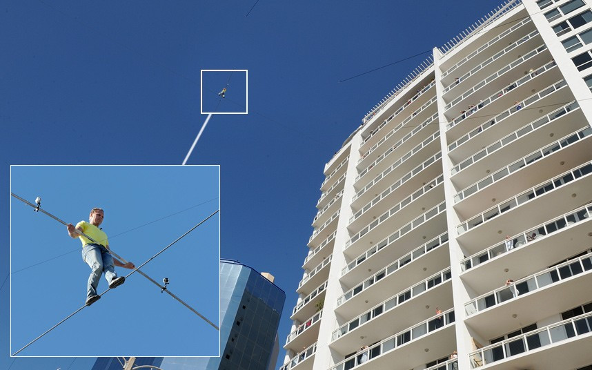 Nik Wallenda walks from a crane to the Marina Tower on a wire, 200 feet in the air in Sarasota, Florida. Wallenda did not have a harness or net for the 600 foot skywalk.