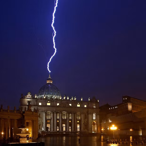 Lighting strikes the dome of the Basilica of St Peter’s in the Vatican, the same day Pope Benedict XVI announced his resignatio
