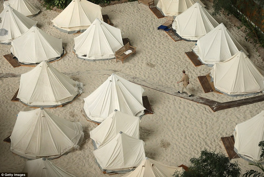 Simple: Guests can also stay in one of the beach tents Read more: http://www.dailymail.co.uk/news/article-2281349/Incredible-pictures-luxury-Tropical-Islands-resort-inside-enormous-German-hanger-surrounded-SNOW.html#ixzz2LQoAHqHi Follow us: @MailOnline on Twitter | DailyMail on Facebook