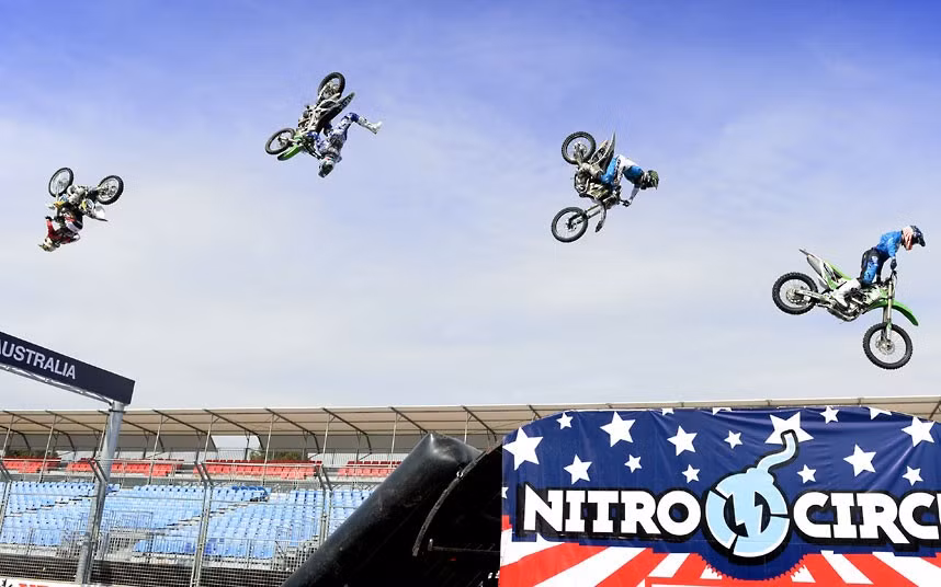 The Nitro Circus crew perform along the Formula One straight and pit lane in the lead-up to the Melbourne Grand Prix