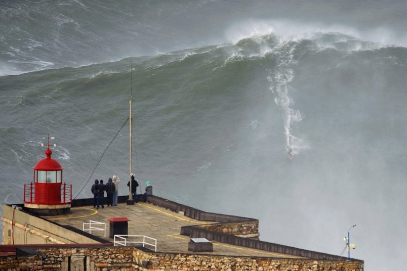 Big-wave surfer Garrett McNamara drops in on a large wave at Praia do Norte in Nazare. McNamara of Haleiwa, Hawaii, who won the Biggest Wave title at the 2012 Billabong XXL Big Wave Awards with his world record 78-foot (24-metre) wave ridden at Praia do Norte on November 1, 2011, has returned to Nazare because he wants to try to beat the record again, and the forecast for the next few days are for very big waves.