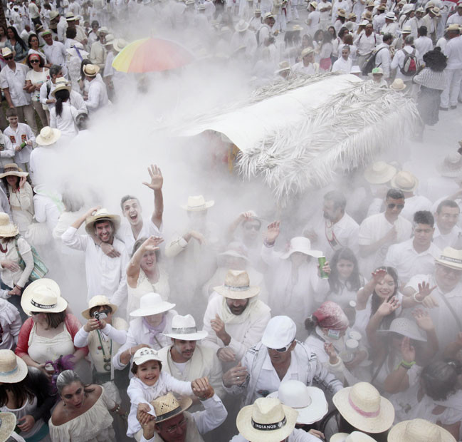People throw talcum powder at one another as they take part in the carnival of Los Indianos (the Indians) in Santa Cruz de la Palma, on the Spanish Canary island of Las Palma