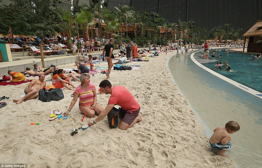 Odd: The ’resort’ is actually located on the site of a former Soviet military air base in Krausnick, Germany Read more: http://www.dailymail.co.uk/news/article-2281349/Incredible-pictures-luxury-Tropical-Islands-resort-inside-enormous-German-hanger-surrounded-SNOW.html#ixzz2LQnOIgqz Follow us: @MailOnline on Twitter | DailyMail on Facebook