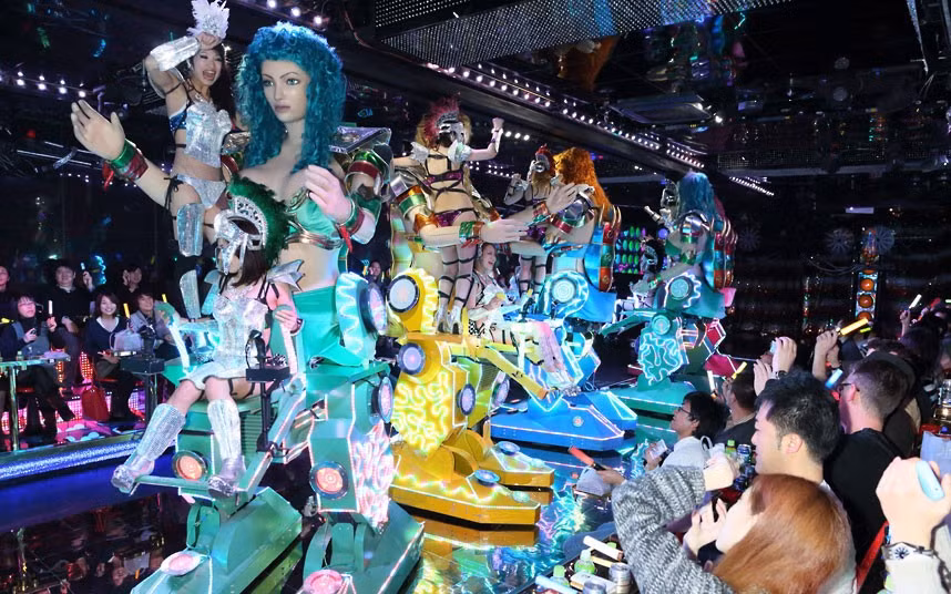 A raunchy robot restaurant has opened in Tokyo, Japan. The strange eatery, which is in the city’s Shinjuku Kabukicho District, is patrolled by giant ’fembots’. These statuesque female robots are controlled by real-life, scantily-clad women.