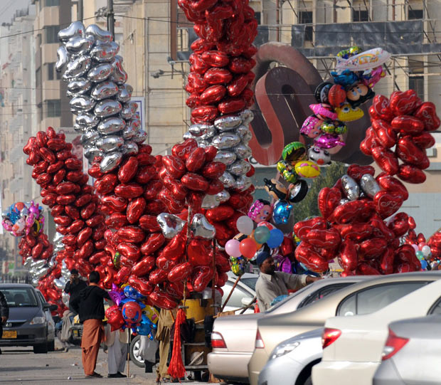 Roadside vendors sell heart-shaped balloons on a street in Karachi on the eve of Valentine’s Day. The holiday is increasingly celebrated in Pakistan, a Muslim country where many conservatives disapprove of the occasion as a Western import.