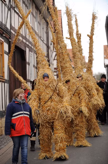 Straw bears are driven through the streets of Heldra, Germany. Winter is traditionally driven out with the straw bears in the village on the river Werra on Ash Wednesday.