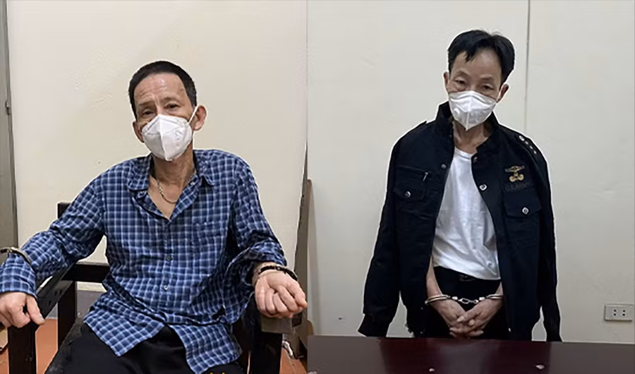 Phạm Đình Quỳnh (trái) và Trần Mạnh Tuấn tại cơ quan chức năng.