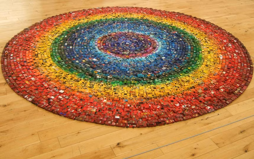 Artist David Waller, from Alexandra Park, north London, spent eight hours arranging his collection of 6,000 toy cars to create this circular rainbow. The 48-year-old has been collecting the metal cars since childhood.