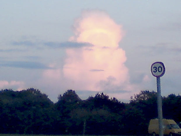 A bizarre face appeared at sunset in a cloud over Clifton Downs, Bristol. The ghostly face was photographed by Nola Hersey on her iPhone while walking in the park. She said: 