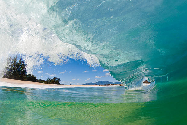 A wave captured by Clark Little on the North Shore of Oahu, Hawaii. Clark produces and sells fine art photography of waves and has captured sunsets, sunrises and marine life surrounded by the ocean crashing around them