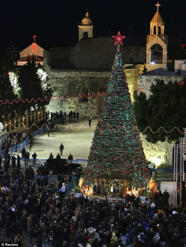 Manger Square, outside the Church of the Nativity, the site revered as the birthplace of Jesus, is seen on Christmas eve in the West Bank town of Bethlehem Read more: http://www.dailymail.co.uk/news/article-2252960/Its-Christmas-time--Celebrations-kick-world-clocks-strike-midnight.html#ixzz2G1gJH6oA Follow us: @MailOnline on Twitter | DailyMail on Facebook