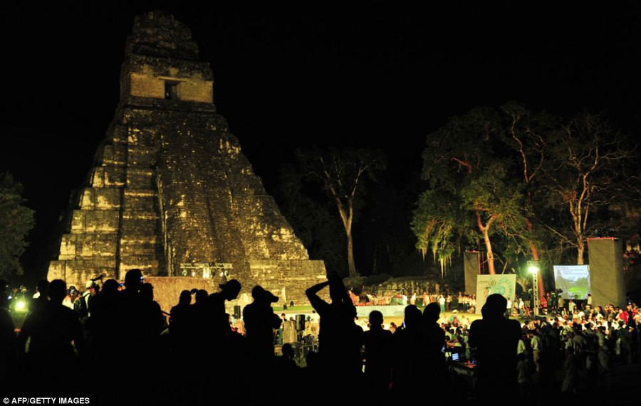 Waiting game: Natives in Guatemala are pictured hosting celebrations marking the end of the Mayan age - foretold in bygone times as the signal for the end of the world - at the Tikal archaeological site Read more: http://www.dailymail.co.uk/news/article-2251450/End-13th-Baktun-Phew-survived-Mayan-Apocalypse-And-virals-begun-.html#ixzz2Fk0BZqBS Follow us: @MailOnline on Twitter | DailyMail on Facebook