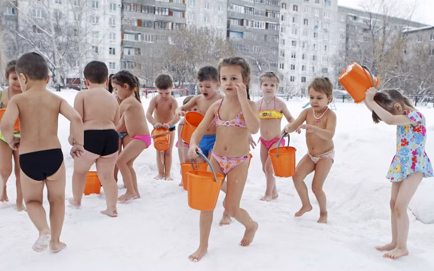Children pour cold water on themselves during daily exercises at a kindergarten, in air temperatures of minus 25 degrees Celsius in Barnaul, Altai region, Russia 