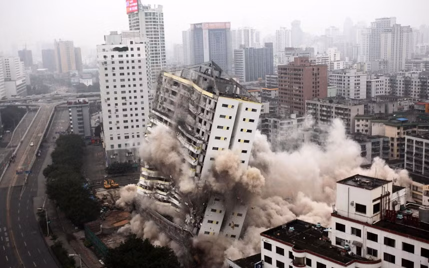 A building is demolished in Haikou, south China’s Hainan province