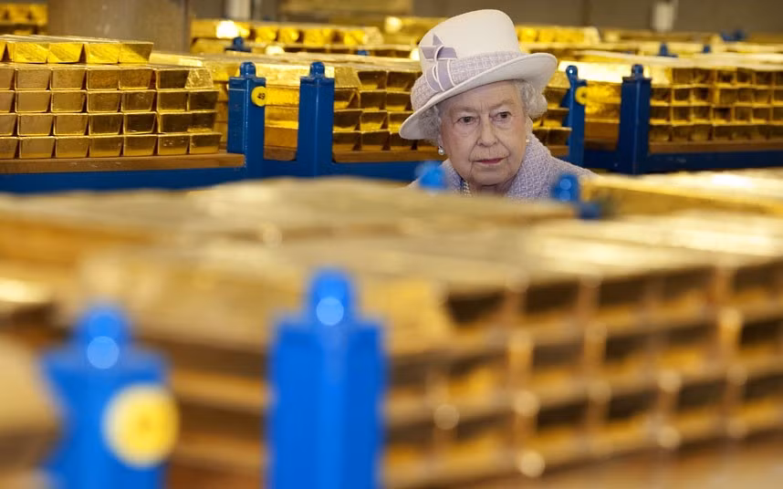 The Queen tours a vault stacked with £27 billion of gold reserves at the Bank of England in London 