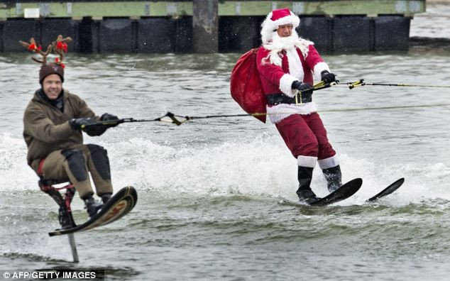 Rudolf with a water-skiing Santa Claus performing on the Potomac River Read more: http://www.dailymail.co.uk/news/article-2252960/Its-Christmas-time--Celebrations-kick-world-clocks-strike-midnight.html#ixzz2G1fQ1heb Follow us: @MailOnline on Twitter | DailyMail on Facebook