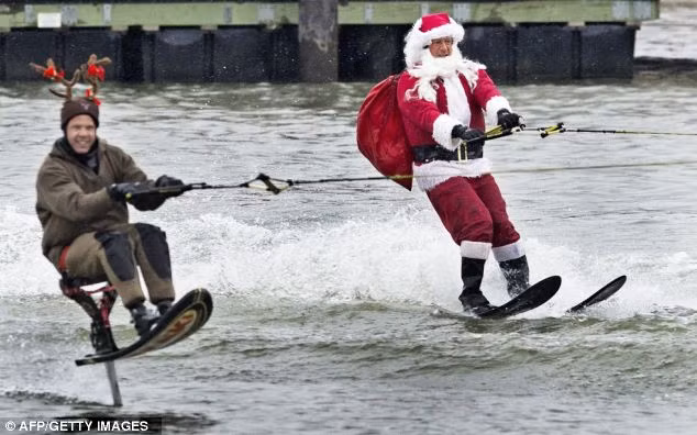 Rudolf with a water-skiing Santa Claus performing on the Potomac River Read more: http://www.dailymail.co.uk/news/article-2252960/Its-Christmas-time--Celebrations-kick-world-clocks-strike-midnight.html#ixzz2G1fQ1heb Follow us: @MailOnline on Twitter | DailyMail on Facebook