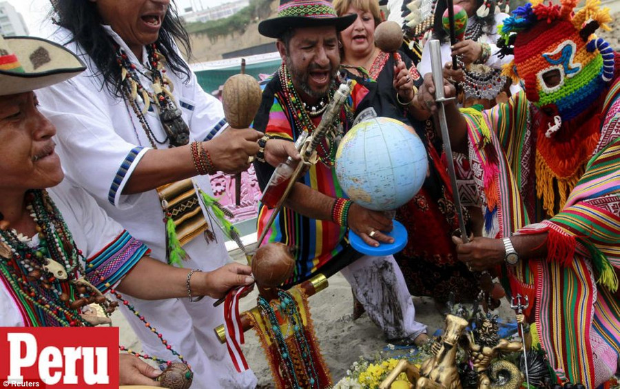 Ritual: Peruvian shamans perform a ritual at a beach to prevent the end of the world, in Lima Read more: http://www.dailymail.co.uk/news/article-2251450/End-13th-Baktun-Phew-survived-Mayan-Apocalypse-And-virals-begun-.html#ixzz2Fk1B0h9p Follow us: @MailOnline on Twitter | DailyMail on Facebook