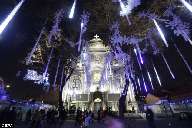 Manger Square, outside the Church of the Nativity, the site revered as the birthplace of Jesus, is seen on Christmas eve in the West Bank town of Bethlehem Read more: http://www.dailymail.co.uk/news/article-2252960/Its-Christmas-time--Celebrations-kick-world-clocks-strike-midnight.html#ixzz2G1gJH6oA Follow us: @MailOnline on Twitter | DailyMail on Facebook