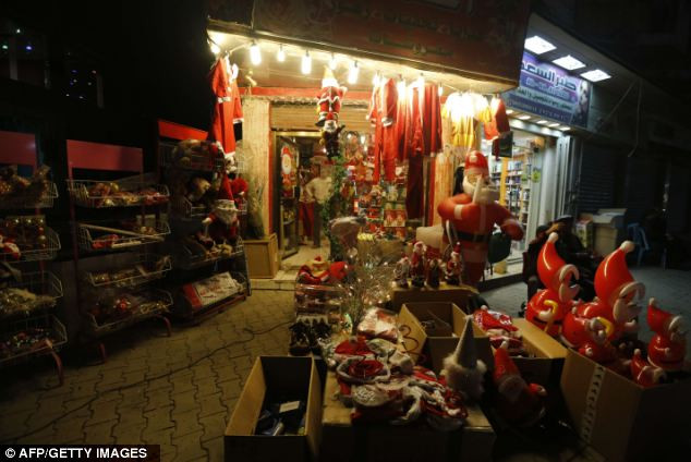 Inflatable Santa Claus and other Christmas decorations are on sale at a shop in Baghdad Read more: http://www.dailymail.co.uk/news/article-2252960/Its-Christmas-time--Celebrations-kick-world-clocks-strike-midnight.html#ixzz2G1fsRq33 Follow us: @MailOnline on Twitter | DailyMail on Facebook