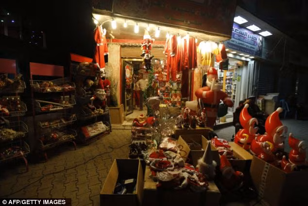 Inflatable Santa Claus and other Christmas decorations are on sale at a shop in Baghdad Read more: http://www.dailymail.co.uk/news/article-2252960/Its-Christmas-time--Celebrations-kick-world-clocks-strike-midnight.html#ixzz2G1fsRq33 Follow us: @MailOnline on Twitter | DailyMail on Facebook