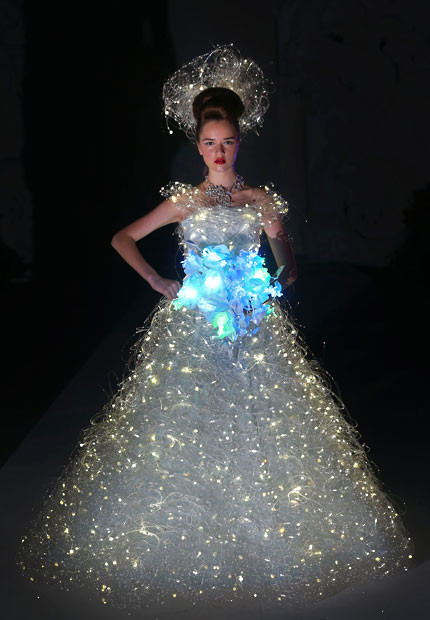 A model showcases a wedding dress that lights up by Japanese designer Yumi Katsura during the Asian Couture 2012 fashion show in Singapore 