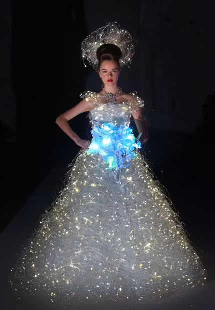 A model showcases a wedding dress that lights up by Japanese designer Yumi Katsura during the Asian Couture 2012 fashion show in Singapore 
