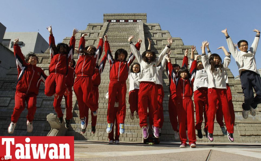 We’re alive! Students in Taiwan jump together in front of a mock pyramid after the countdown time when many believe the Mayan people predicted the end of the world Read more: http://www.dailymail.co.uk/news/article-2251450/End-13th-Baktun-Phew-survived-Mayan-Apocalypse-And-virals-begun-.html#ixzz2Fk1eeV58 Follow us: @MailOnline on Twitter | DailyMail on Facebook
