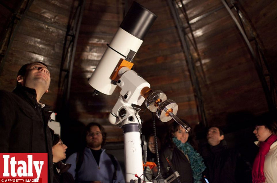 On stand by: Visitors and members of Naples amateur astronomy association ’Unione Astrofili Napoletani’ stand by a telescope to dispute the world ending Read more: http://www.dailymail.co.uk/news/article-2251450/End-13th-Baktun-Phew-survived-Mayan-Apocalypse-And-virals-begun-.html#ixzz2Fk1wHEmh Follow us: @MailOnline on Twitter | DailyMail on Facebook