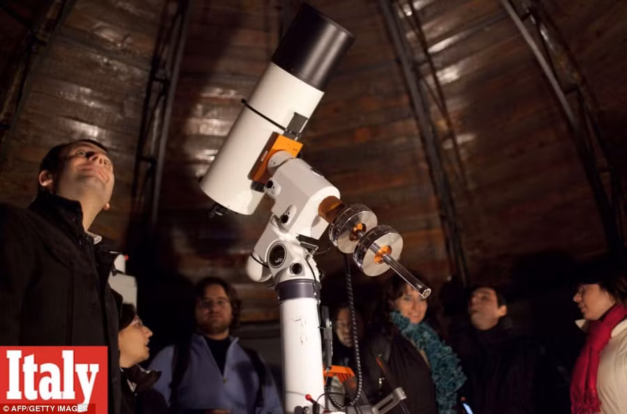 On stand by: Visitors and members of Naples amateur astronomy association ’Unione Astrofili Napoletani’ stand by a telescope to dispute the world ending Read more: http://www.dailymail.co.uk/news/article-2251450/End-13th-Baktun-Phew-survived-Mayan-Apocalypse-And-virals-begun-.html#ixzz2Fk1wHEmh Follow us: @MailOnline on Twitter | DailyMail on Facebook