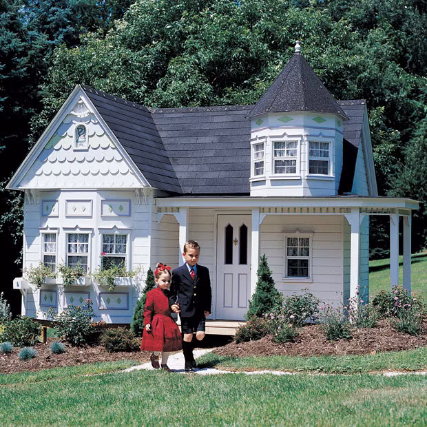 Two children walk outside the Grand Victorian wendy house, which costs $19,999 (nearly £13,000) in Finleyville, Pennsylvania. Super-rich parents bent on spoiling their kids are forking out over £65,000 to have luxury wendy house ’high streets’ built in their gardens. Lilliput Play Homes provides the ultimate in rich kid playtime entertainment made up of whole miniature avenues containing replica fire stations, surgeries and houses. All of the playhouses have lavish interiors with accessories and furniture - and some even have working electricity for air conditioning should some of the kids get too hot. 