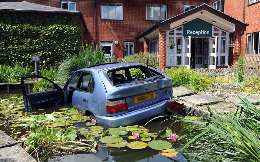 Two women, believed to be in their 70s, were rescued from a car after it plunged into an ornamental pond at the BMI St Edmunds Hospital in Suffolk. The 6ft-deep pond has a metal safety mesh under the water to preventpeople drowning, but the blue Toyota Corolla was still partly submerged. The frightened women could not get out of their car and fire crews had to be called to rescue them. The driver told firefighters she panicked afterreversing into a post and jammed her foot on the accelerator.