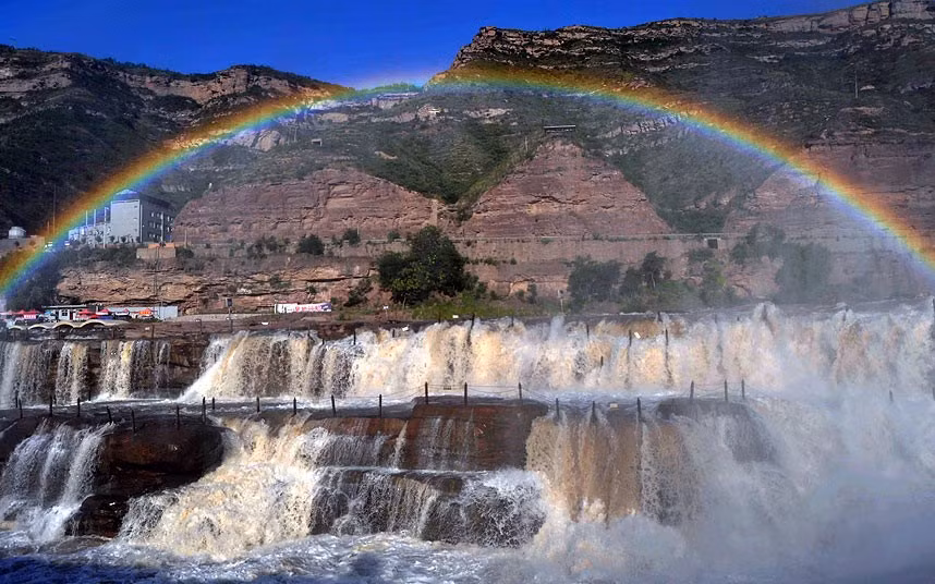 A rainbow above the Hukou (Kettle’s Mouth) Waterfall in the Shanxi-Shaanxi section of the Yellow River valley in China