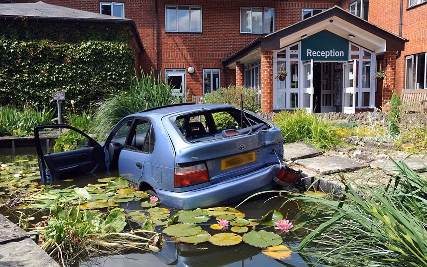 Two women, believed to be in their 70s, were rescued from a car after it plunged into an ornamental pond at the BMI St Edmunds Hospital in Suffolk. The 6ft-deep pond has a metal safety mesh under the water to preventpeople drowning, but the blue Toyota Corolla was still partly submerged. The frightened women could not get out of their car and fire crews had to be called to rescue them. The driver told firefighters she panicked afterreversing into a post and jammed her foot on the accelerator.