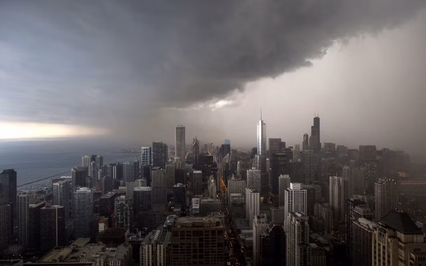 A thunderstorm with heavy rains approaches downtown Chicago