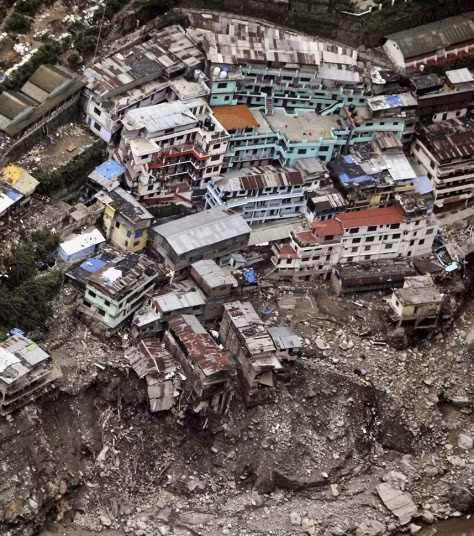 A view of houses damaged by monsoon rains in Shrinagar, India