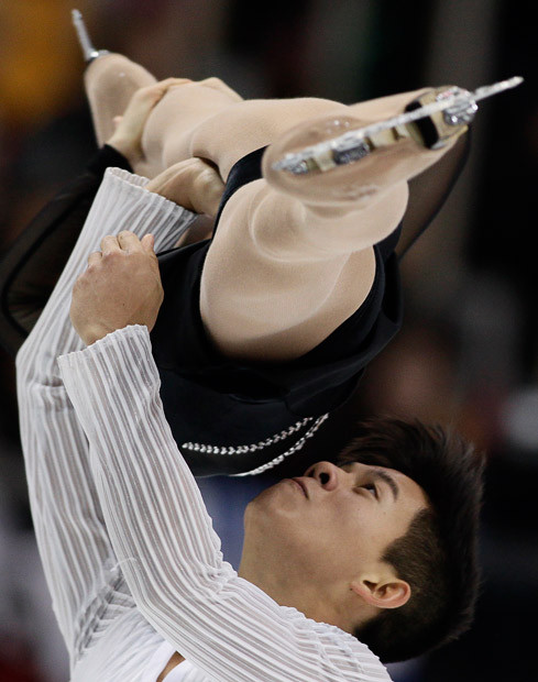 Takahashi Narumi (top) and Tran Mervin of Japan skate their short programme during the Cup of Russia figure skating Grand Prix event in Moscow