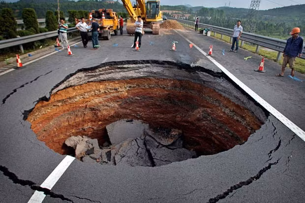 A sinkhole appeared on a highway in Quzhou, Zhejiang province of China, in June 2010
