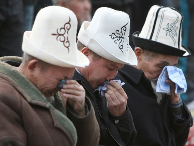 Men attend prayers during Kurban-Ait, also known as Eid al-Adha, at a square in Bishkek, Kyrgyzstan