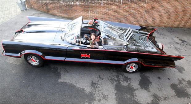 Claire Wood of firebox.com sits in a replica of the Bat Mobile from the 1960s TV series. The company is selling custom made replica versions of the car for £120,000