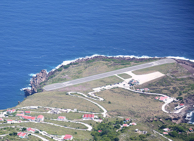 Juancho E. Yrausquin Netherlands Antilles This runway is certainly not for nervous fliers. At 1,300-ft long, it’s only fit for small aircraft and is considered by pilots to be one of the most challenging to land upon. It is flanked by high hills on one side and sheer drops on the other three. 