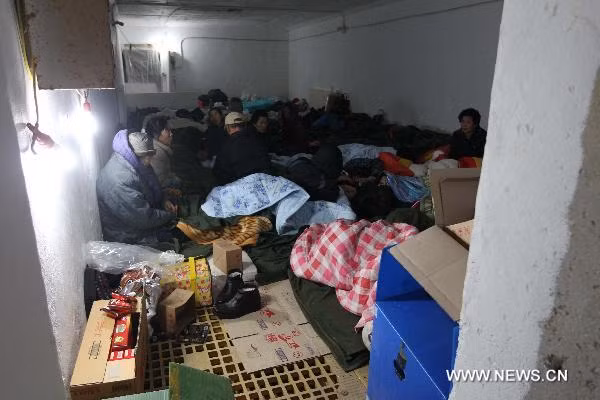 Local residents take refuge in an air raid shelter on the Yeonpyeong Island