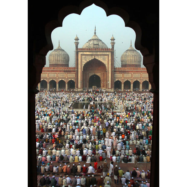 Muslims observe Eid al-Adha at the Jama Masjid (Grand Mosque) in the old quarters of Delhi, India. 