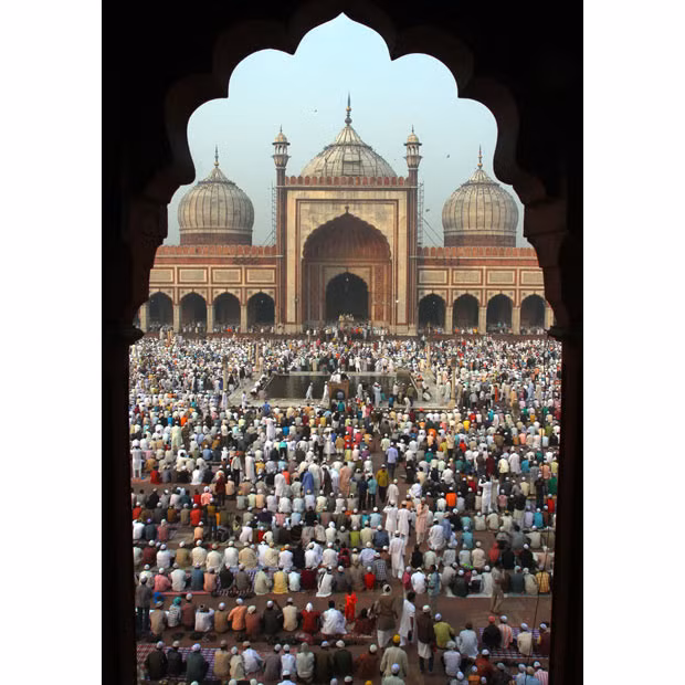 Muslims observe Eid al-Adha at the Jama Masjid (Grand Mosque) in the old quarters of Delhi, India. 