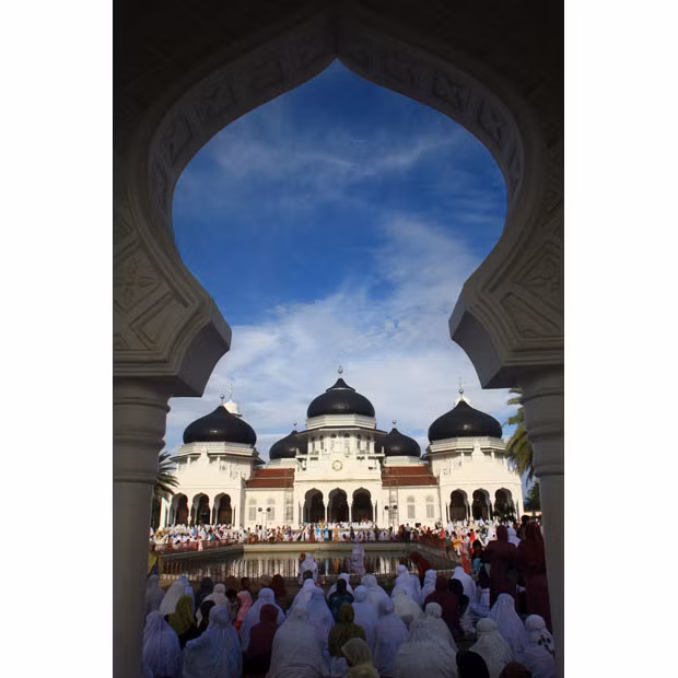 Muslims perform Eid al-Adha prayers at Baiturrahman Grand Mosque, Banda Aceh, Indonesia
