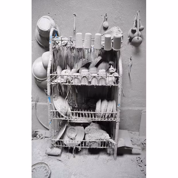 Những hình ảnh ấn tượng trong tuần ảnh 17 Kitchen utensils are pictured covered with volcanic ash from the eruption of Indonesia’s Mount Merapi, in the central Javan village of Argomulyo